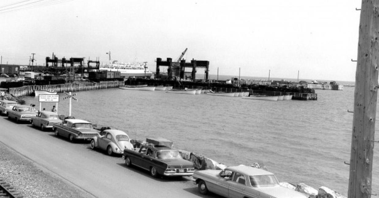 cars line up to board boat