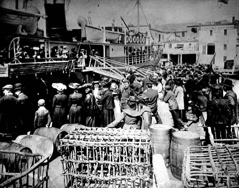 Image: black and white, passengers waiting to board the SS Portia