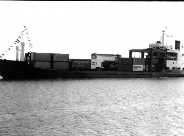 Image: black and white, unidentifiable ship transporting shipping containers 